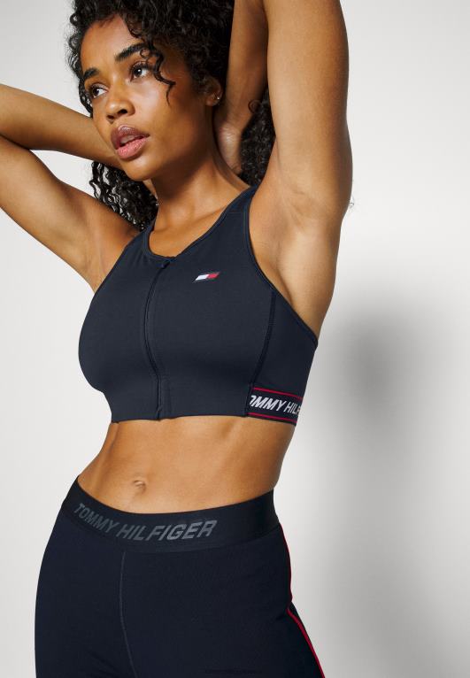 شريط ذو علامة تجارية لسماء الصحراء Tommy Hilfiger حمالة صدر رياضية متوسطة الدعم بسحاب من خلال الشريط 446447097